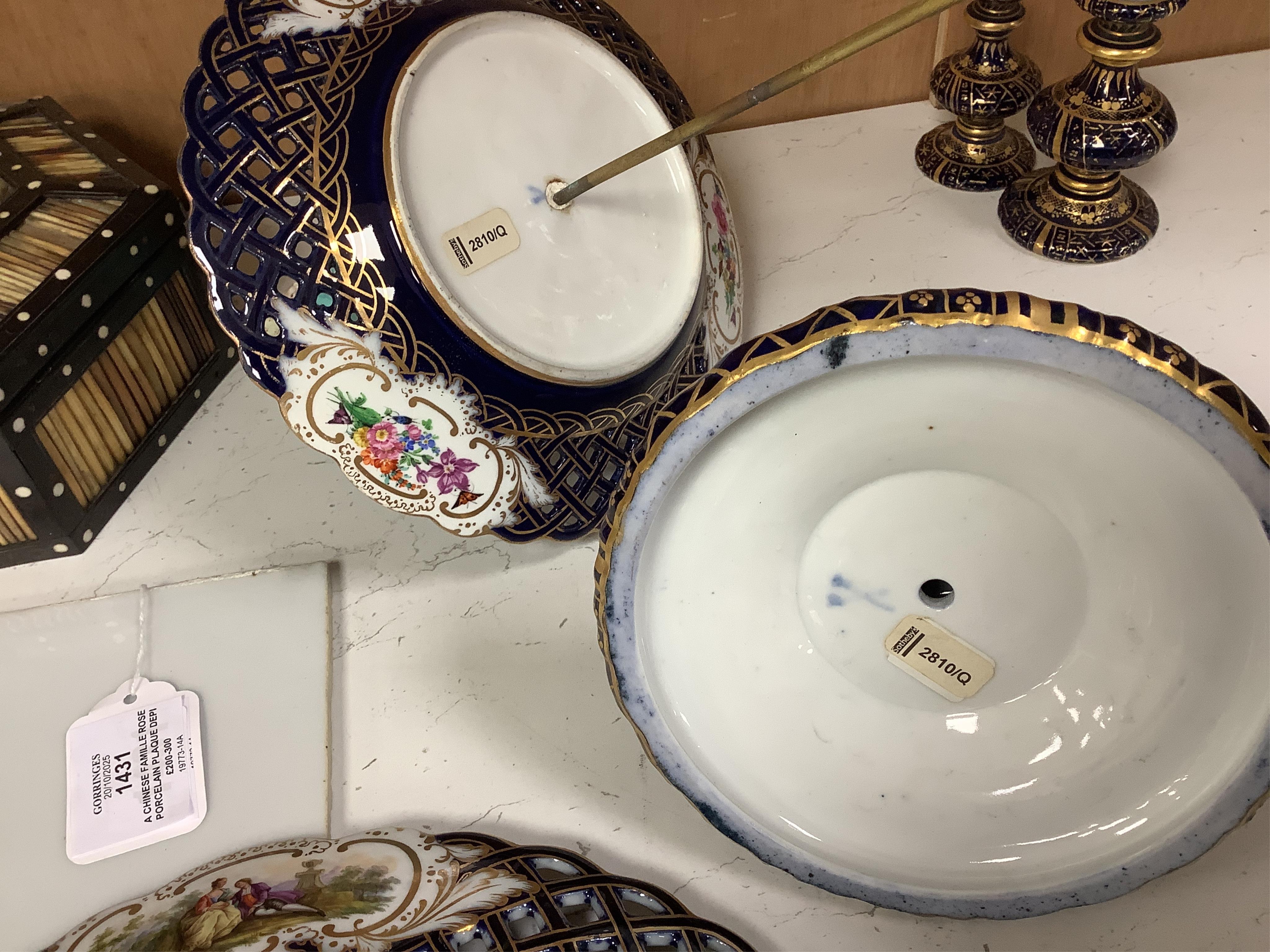 A pair of late 19th century Meissen three tier cake stands with figural tops, 48cm high